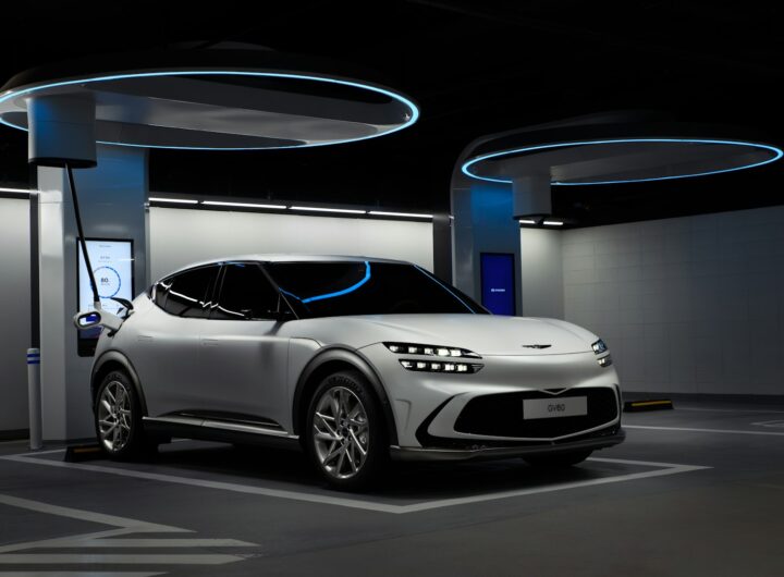 a white sports car in a showroom ricarica veloce auto elettriche Milano